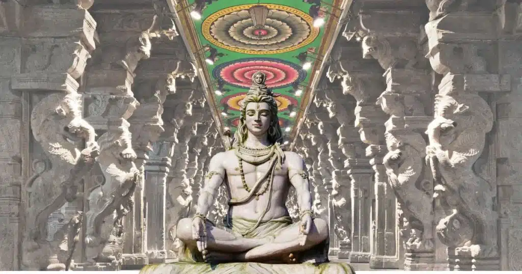 lord shiva quotes in tamil A digital art piece depicting a statue of Lord Shiva seated in a temple, surrounded by intricately carved pillars and a vibrant ceiling design.