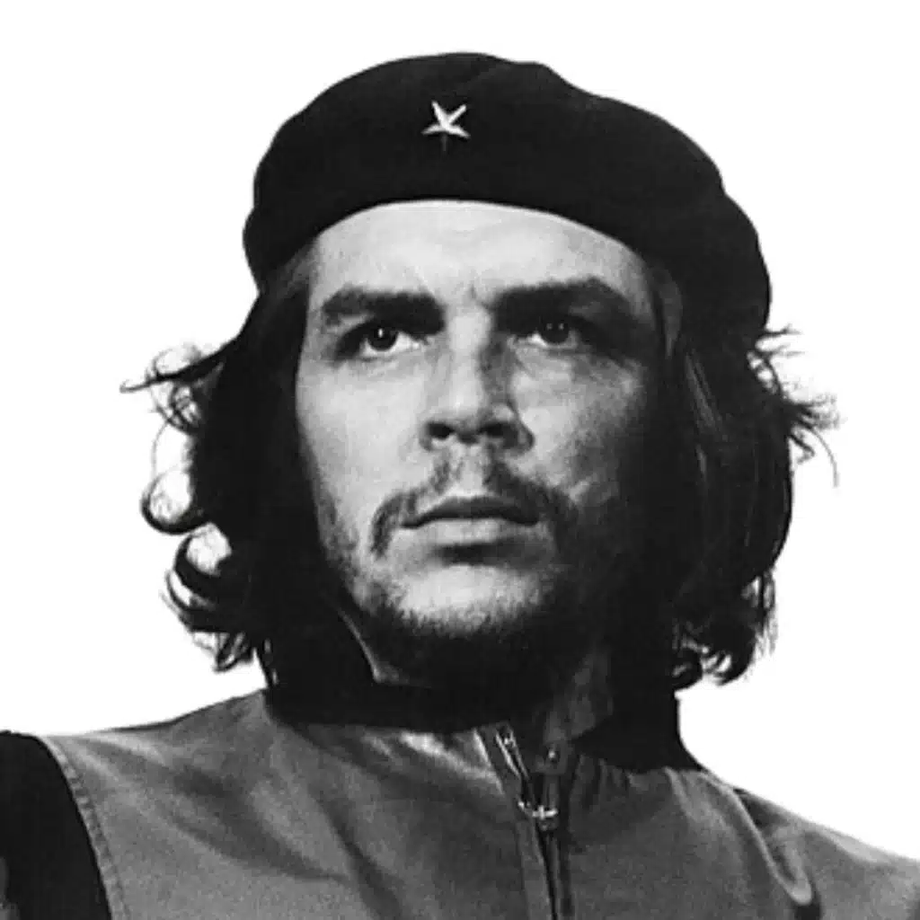 che guevara quotes in tamil A black and white iconic portrait of a man with long, wavy hair, a beard, and a mustache, wearing a black beret adorned with a single star. His expression is serious and determined as he gazes into the distance.